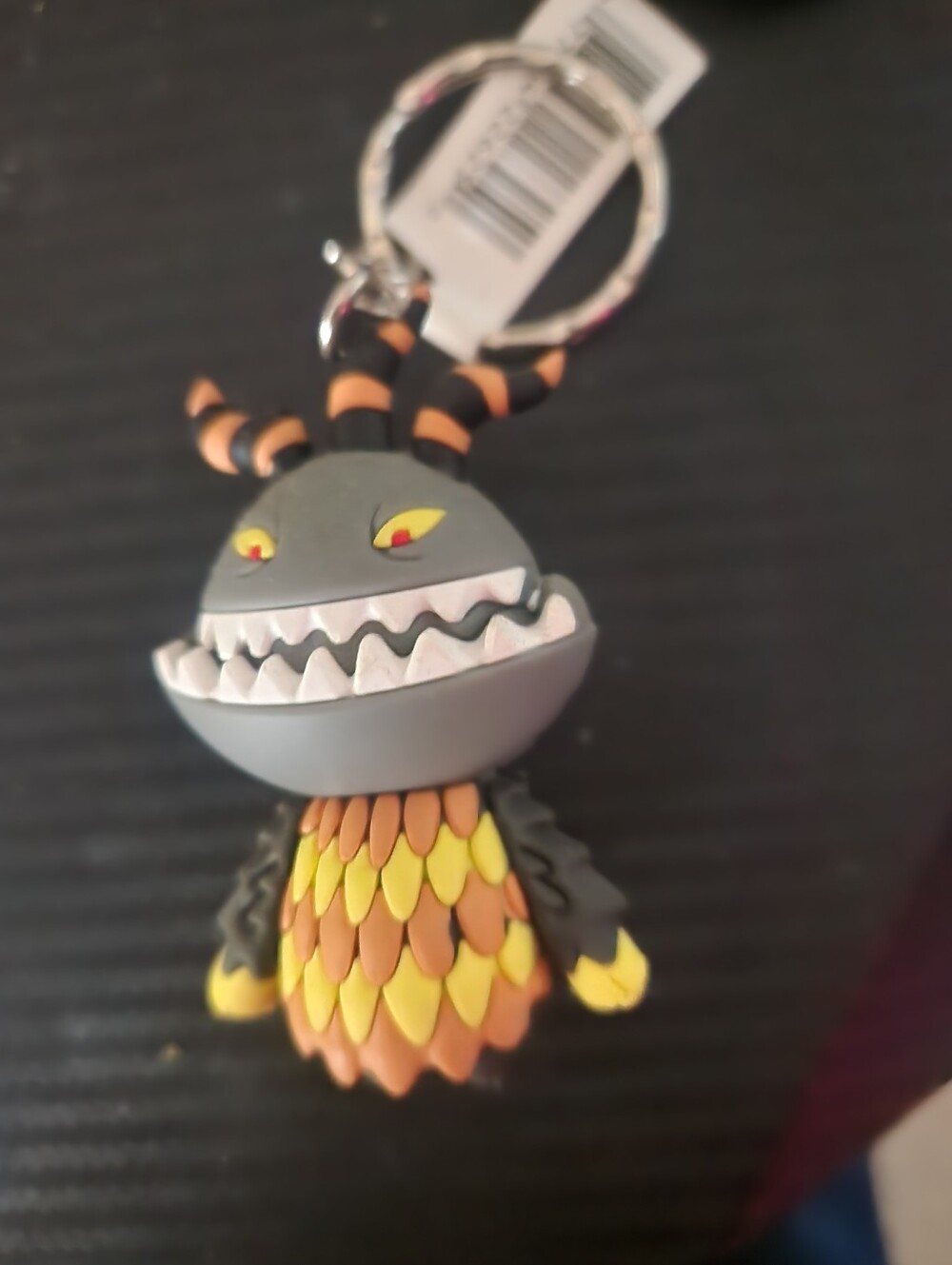 Disney How to Train Your Dragon Toothless keychain with orange and yellow scales